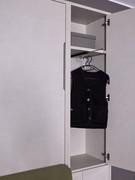 All-In wardrobe column for foldaway beds equipped with pull-out coat rack and internal shelf