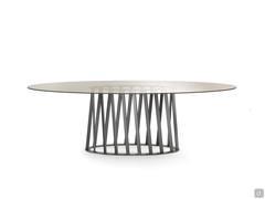 Table with perforated metal base Globo with oval bronzed clear glass top