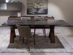 Still extending table with a porcelain stoneware top in the finish Portoro and legs made from Canaletto Walnut wood