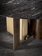 Detail of the steel base of the table Mirage: obvious references to the metal elements of the other products in the collection