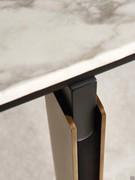 Detail of the legs of Cantori's Mirage table in the barrel version: the black lacquered wood undertop ties together the bronzed frame and marble top