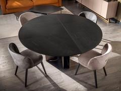 Modern table Mirage by Cantori in the round version with a wooden top, again divided into several parts and assembled with opposing veins