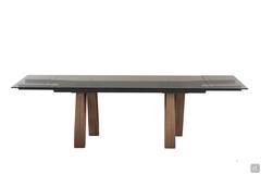 Butterfly extending table with clear bronze glass top and Canaletto walnut legs