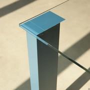 Detail of the rectangular, sky blue matt lacquered leg