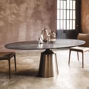 Yoda design table with base by Cattelan, here proposed with structure in satin-finish titanium painted metal and elliptical top in Keramik ceramic (finish not available)