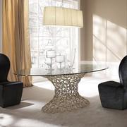 Mondrian comes with an elliptical or round glass top with luxury golden structure