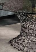 Detail of the sculptural plinth, a veritable cascade of iron rings of different sizes