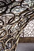 Detail of solid iron rod rings, made integral by hand-polished "wire" welds