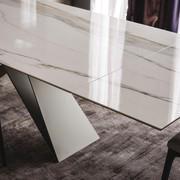 Detail of the extending top of Cattelan's Premier table in Keramik Marble Golden Calacatta polished stone