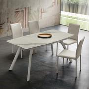 Jeremy extending table also available with barrel-shaped top in Laminam stone