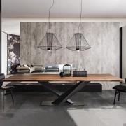 Irregular-edged solid walnut top of the Stratos table by Cattelan