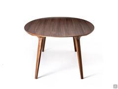 Side view of Leander table, please notice the particular cut of the elliptical top with shaped wooden borders