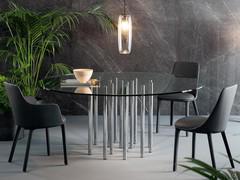 Mille round table by Bonaldo with clear glass table top and chromed metal cylindrical legs