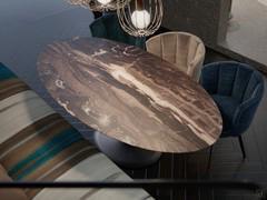 Stem dining table, with an oval table top in Cappuccino marble 