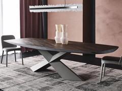 Tyron by Cattelan table with burnt oak solid wood top. Crossed base in embossed steel graphite.