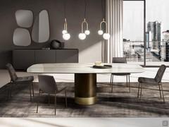 Hidalgo elegant dining table with shaped top in glossy Calacatta Gold ceramic and base in bronze/gold