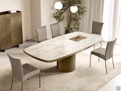 Hidalgo ceramic table with central base and rounded, lacquered wooden sub-top