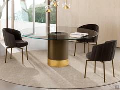 Hidalgo table with round clear glass top and two-tone metal base