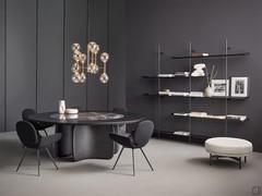 Table with central base design Mellow by Bonaldo, ideal in minimalist settings as in the case of the living room shown in the photo