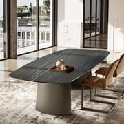 View of the Edwin fixed table with sail-shaped base from the side. Shaped tabletop in Matt Portoro ceramic and base in Titanium-finish painted metal.