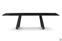 Edwin fixed table with sail-shaped base from above. Rectangular tabletop in glossy-black painted glass and base in Black painted metal.