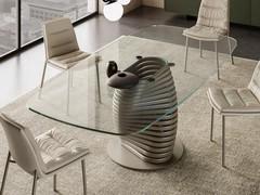 Living room table Vortex: The shaped top in extra-clear extra-clear glass is perfect to set off the designer base, offered here in titanium-painted metal