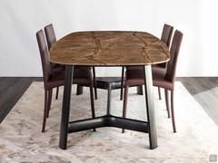 Short side view of dining table Conrad with Rainforest Brown marble top and black ash frame