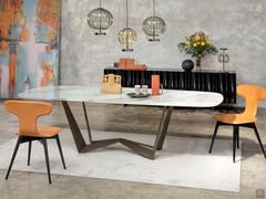 Dining table with reversible base Reverse, offered here in the version with artistic glass top