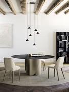 Torquay round table with wrap-around titanium-coloured painted metal base and black hammered glass top