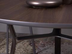 Rey dining table with metal legs is made stable and self-reliant by a central metal under-top frame