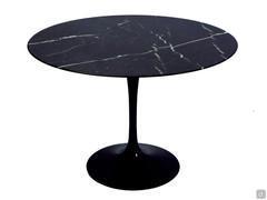 Saarinen table with round black Marquina marble top and central base with a fluid, sinuous appearance