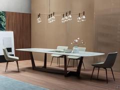 Art table by Bonaldo with metal base and shaped top in calacatta macchia vecchia ceramic