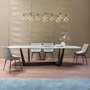 Art table by Bonaldo with metal base and shaped top in calacatta macchia vecchia ceramic 