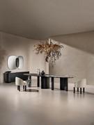 Lotus table with big proportions and organic design in Absolute Black ash combined with precious Antique Black marble