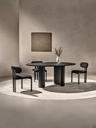 Lotus table in Small version here proposed in total-black effect with top and bases in black material