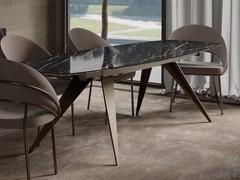 Table with pointed legs Pegaso, offered here in an extendable barrel version with a glass-ceramic top