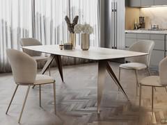 The table with pointed legs Pegaso is available both fixed and extendable, also with a glass-ceramic top, offered here in a matte calacatta finish to match the kitchen top