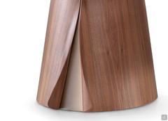 Detail of the veneer that lifts into two flaps and allows a glimpse of the bronze metal finish