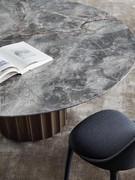 Dorian by Bonaldo round table with stone top and high density polyurethane base