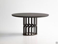 Round table Intreccio with solid wood base and extending wooden top