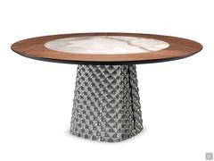 In the version with Keramik stone insert, the table features elegant black chrome details