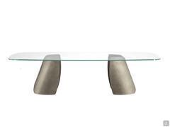 Akeyo shaped glass top table characterised by its special curved shapes and lines