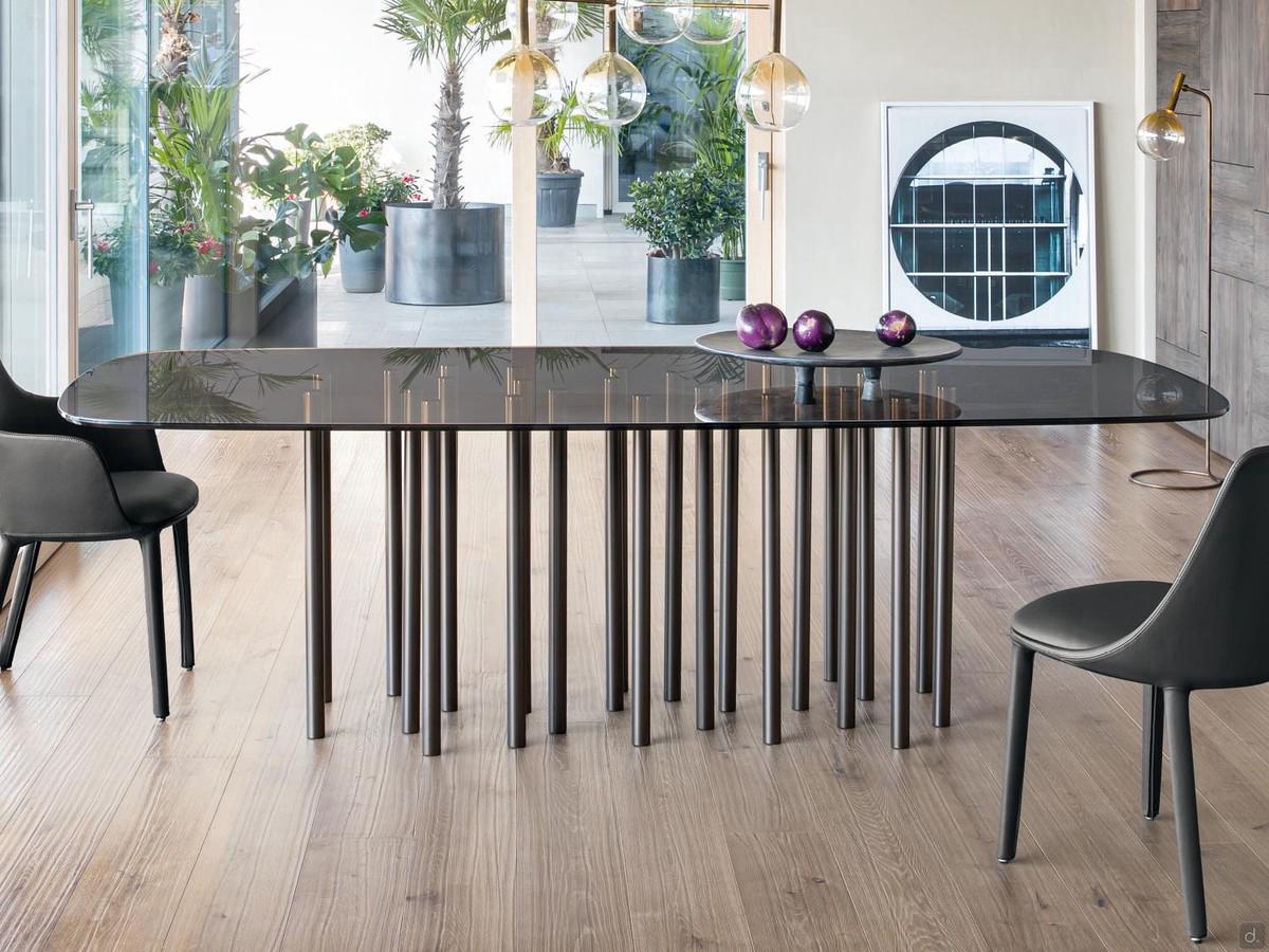 Mille table by Bonaldo with several cylindrical legs 