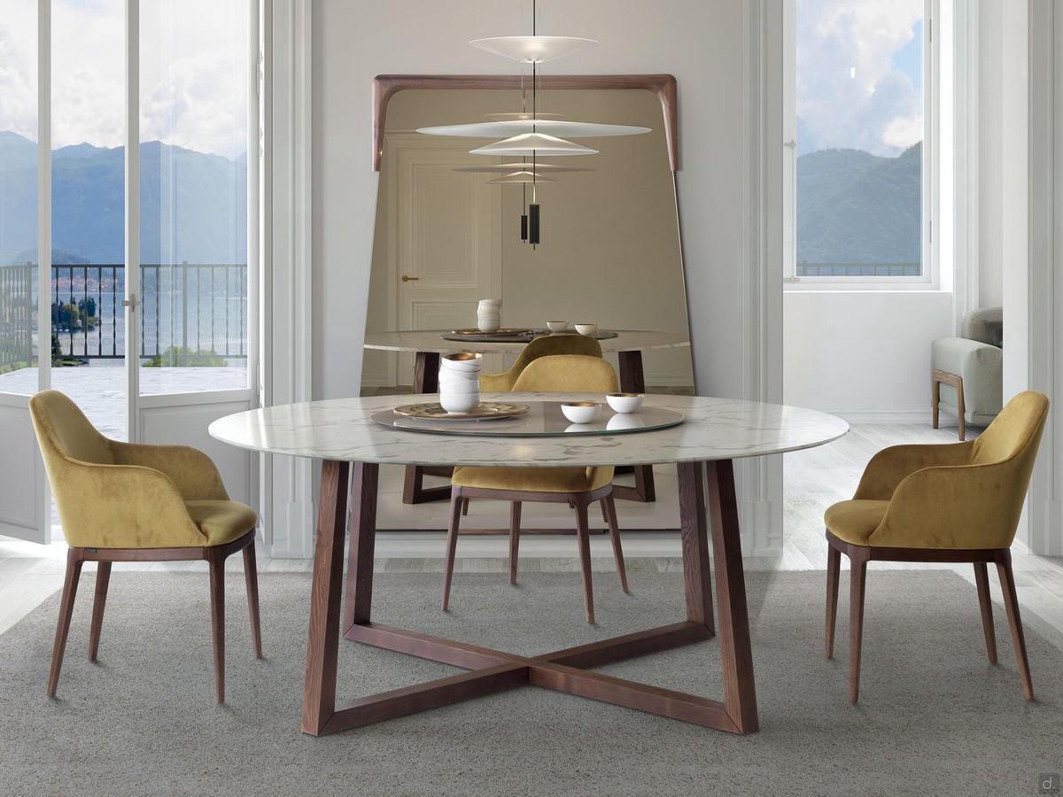 Modern living room table Coast with round marble top and solid wood frame, presented with Bungie mirror in the background