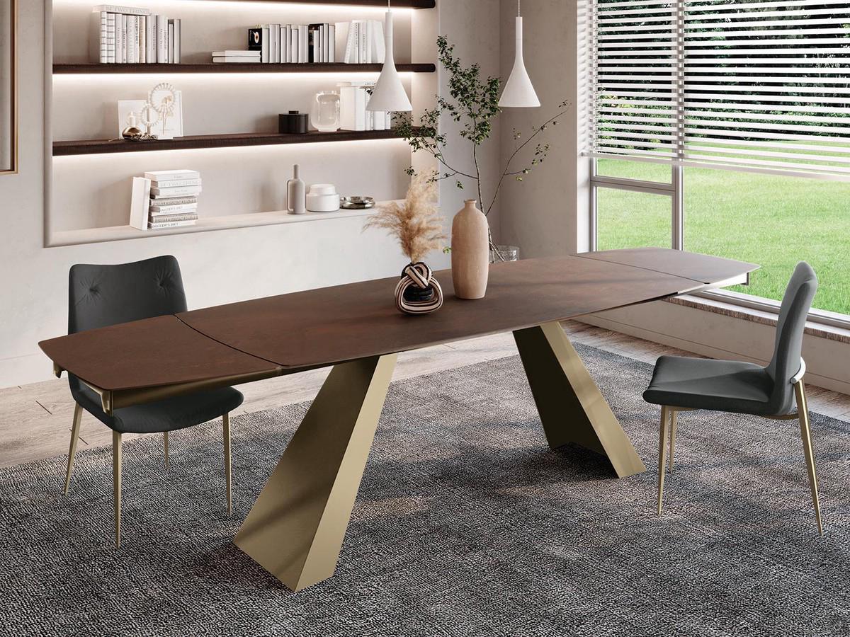 Desire extending table with matte oxide brown ceramic top and bronze painted metal base