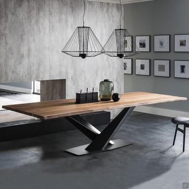 Stratos is a wooden dining table with x-shaped base by Cattelan