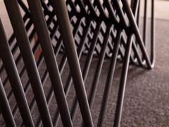 Detail of charcoal grey lacquered tubular metal base