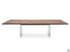 Ikon table by Cattelan with extra-clear glass legs and wooden top in Canaletto walnut