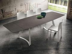 Extendable table with Eddard trestle frame with the side extensions extended. They are always available in the same colour as the top, in stratified HPL or stratified Fenix