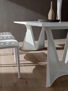 Jeor dining table with design legs in white painted metal and top in white Fenix kos